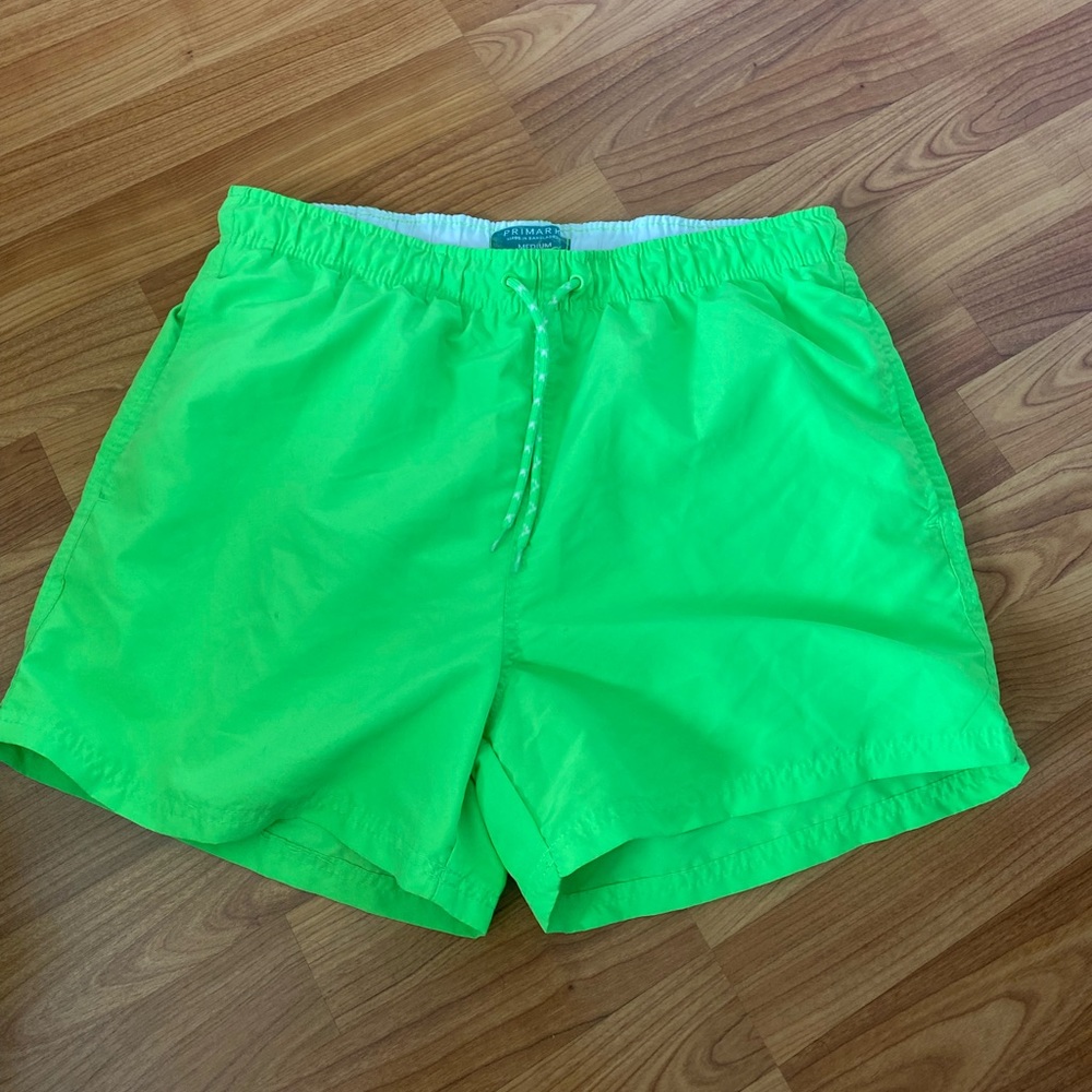 Bright neon green bathing suit swim trunks shorts from Primark.